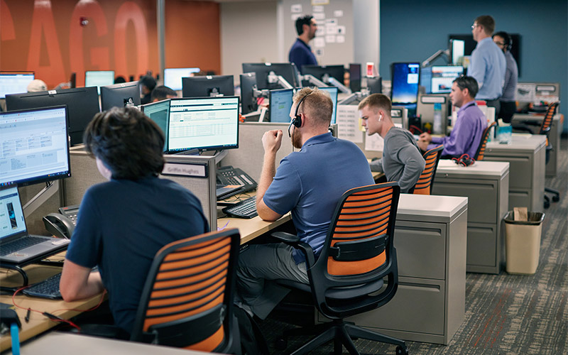 Freight Sector analyst desk team coordinating shipments